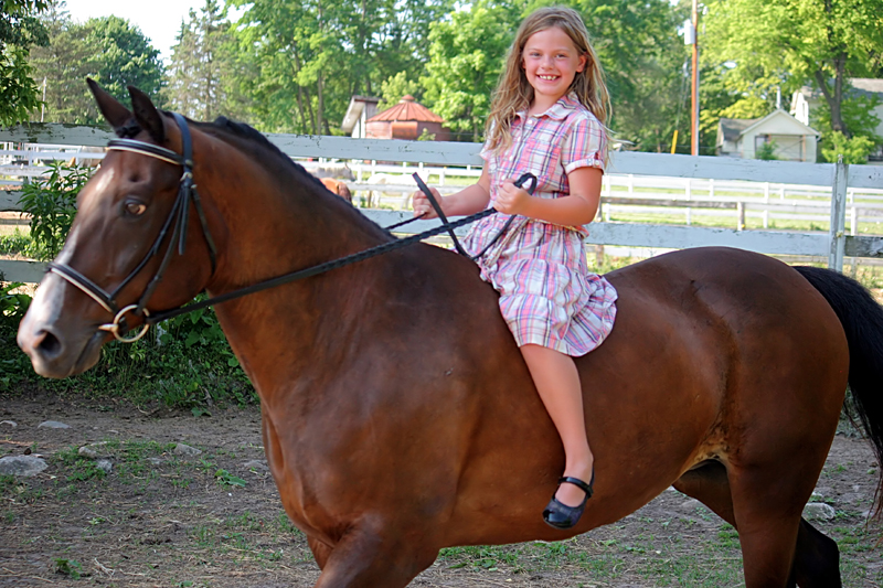 Two girls and two horses