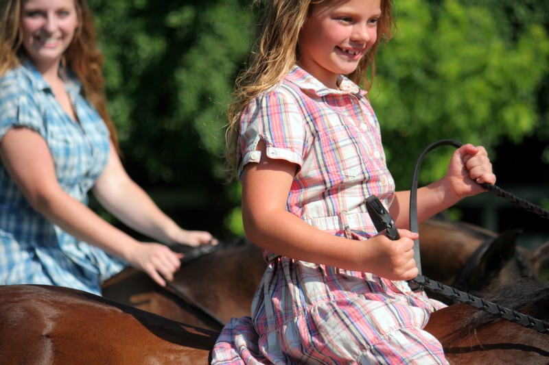 Two girls and two horses
