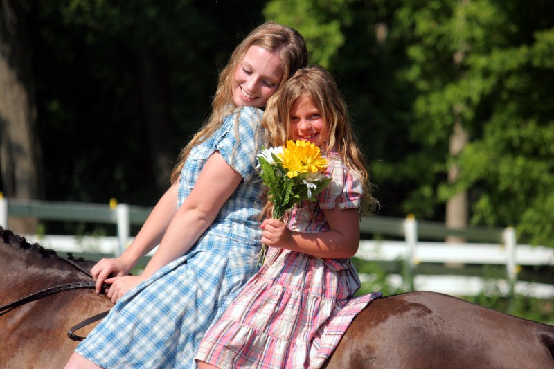 Two girls and two horses