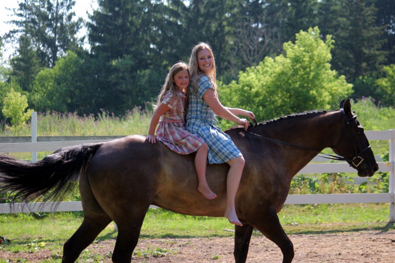 Two girls and two horses